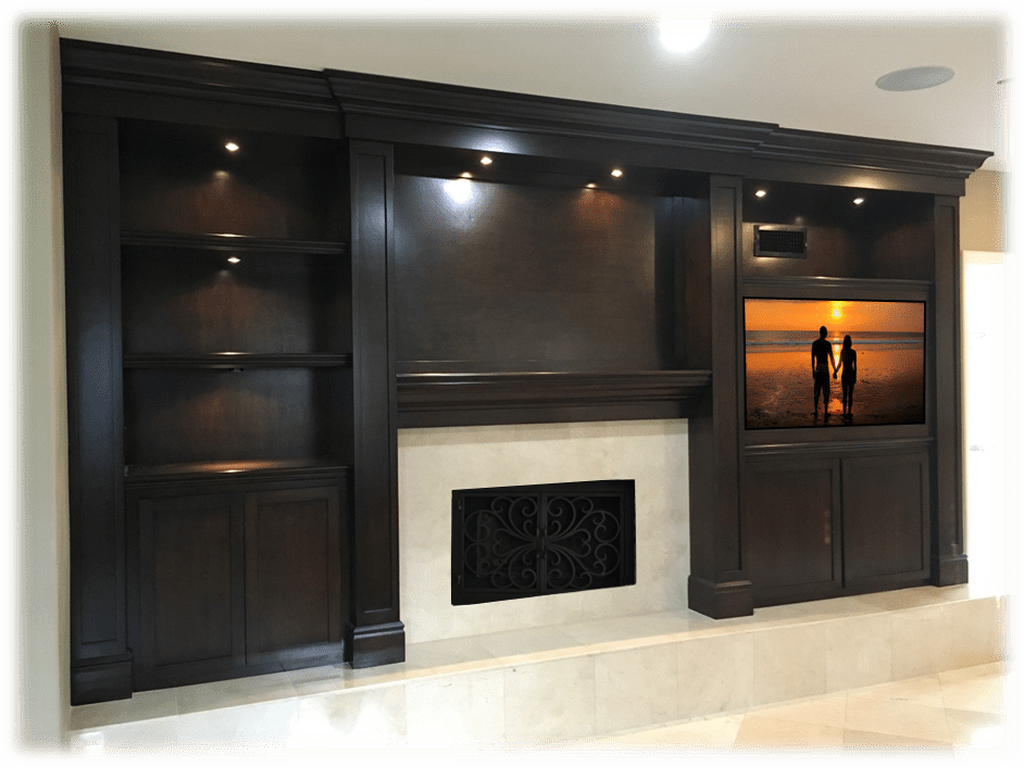 A fireplace and entertainment center in a living room.