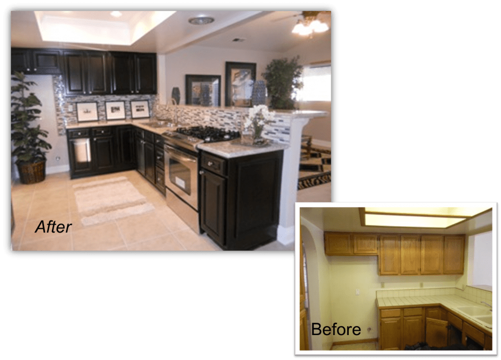 A kitchen with black cabinets and white counter tops.