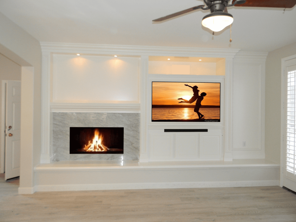 A living room with a fireplace and a flat screen tv.