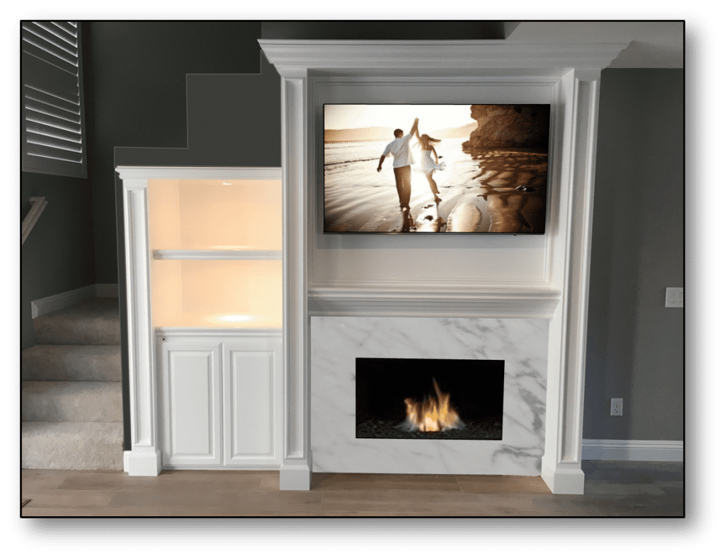 A fireplace with a television mounted above it.