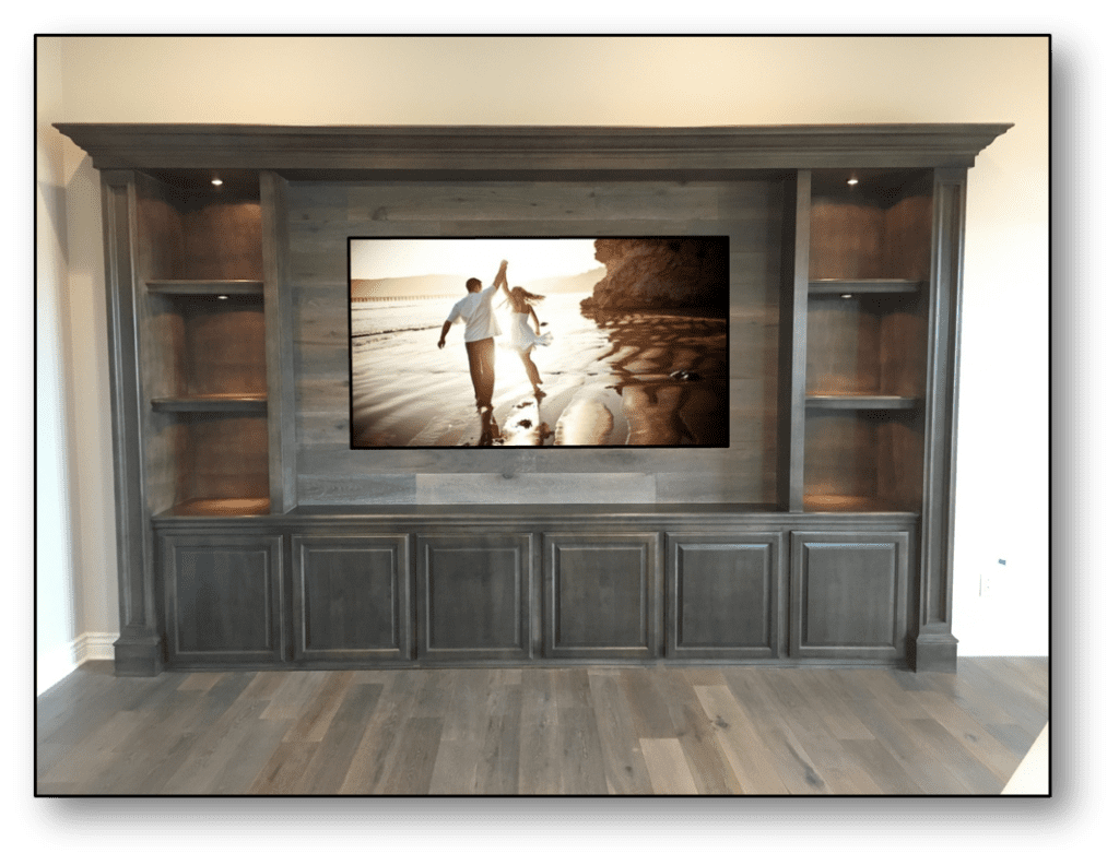 A large flat screen tv mounted to the wall.