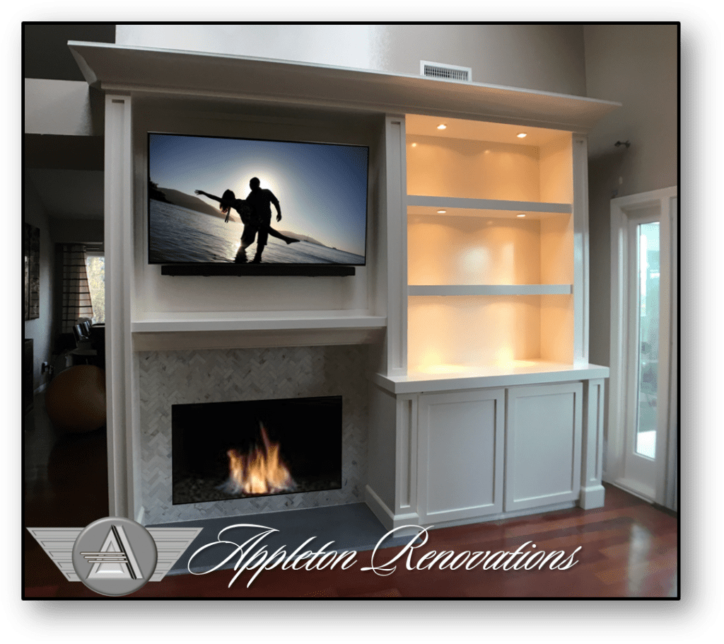 A television mounted on the wall above a fireplace.