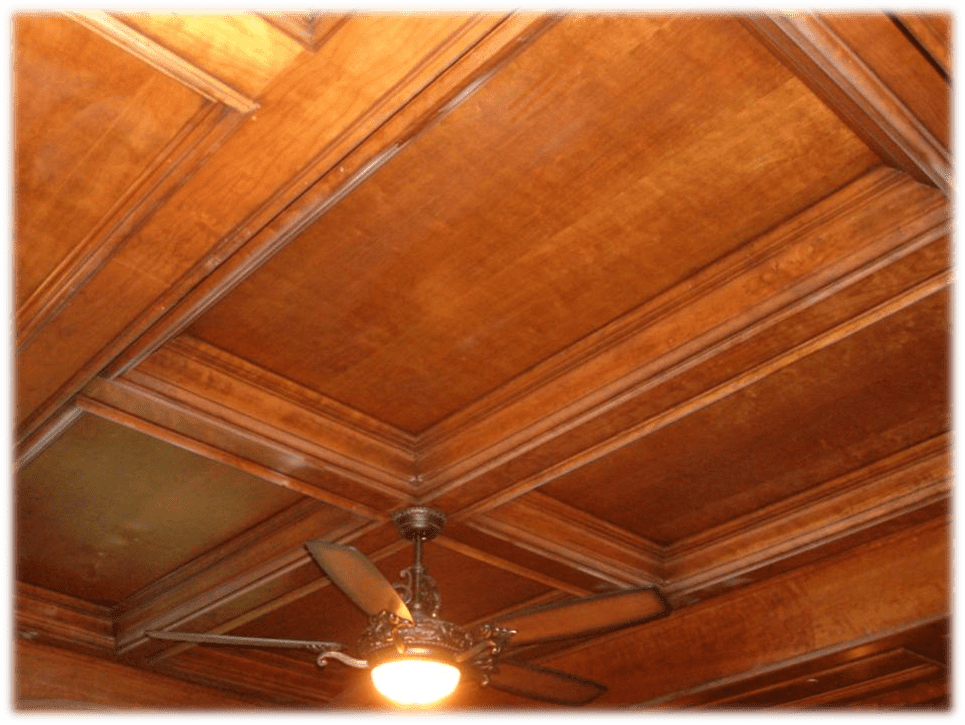 A ceiling fan in the center of a room.