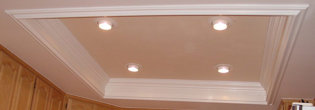 A ceiling with lights and a white wall