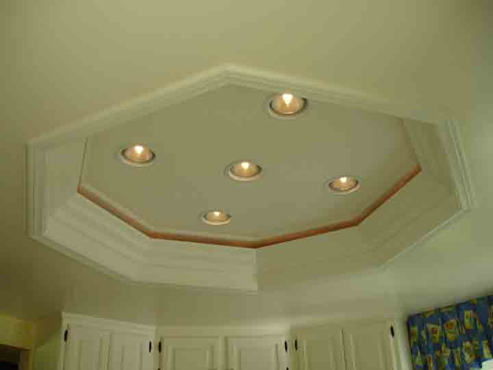 A kitchen ceiling with lights on the top of it.