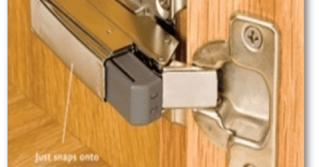 A close up of the door hinge on a sliding glass door