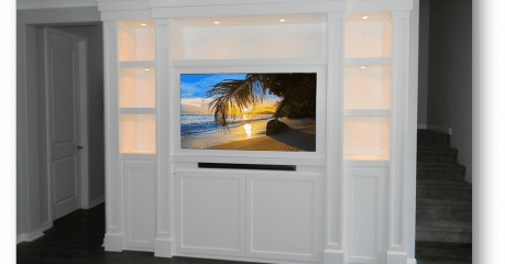 A television mounted on the wall in a room.