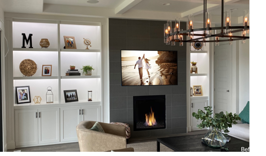 A living room with a fireplace and a television.