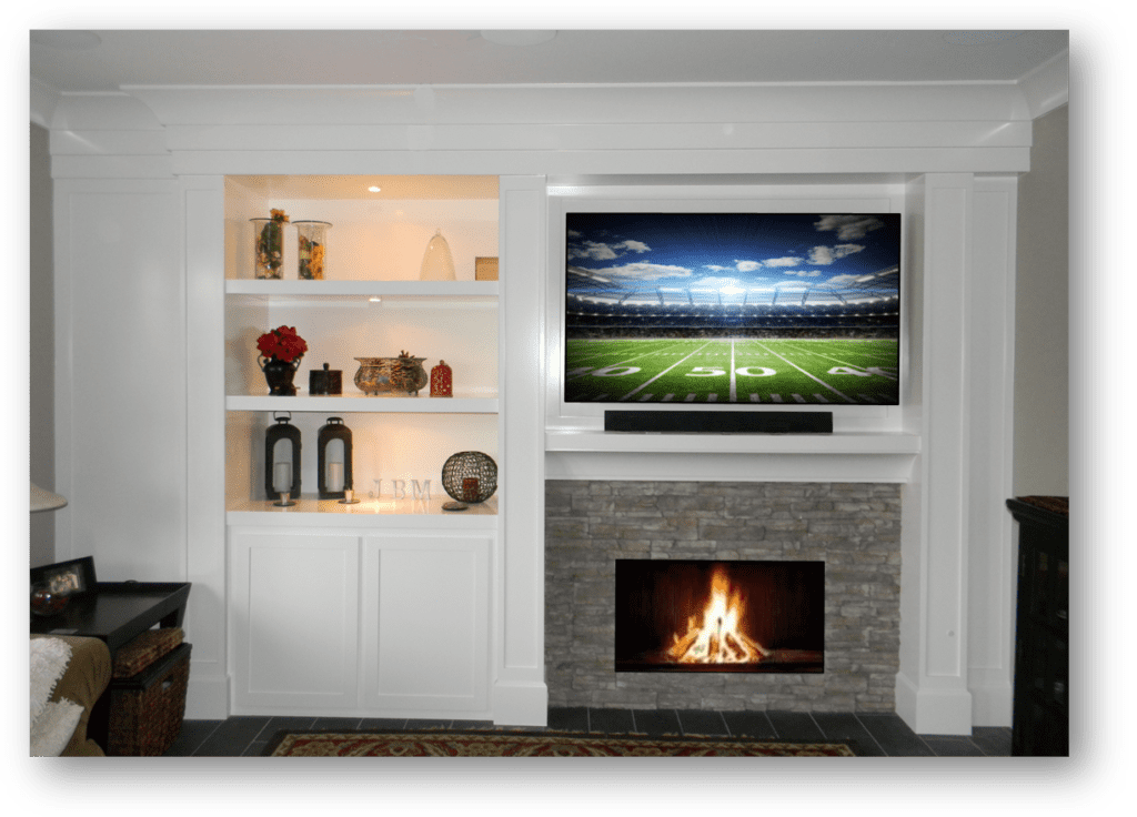 A living room with a fireplace and a television.