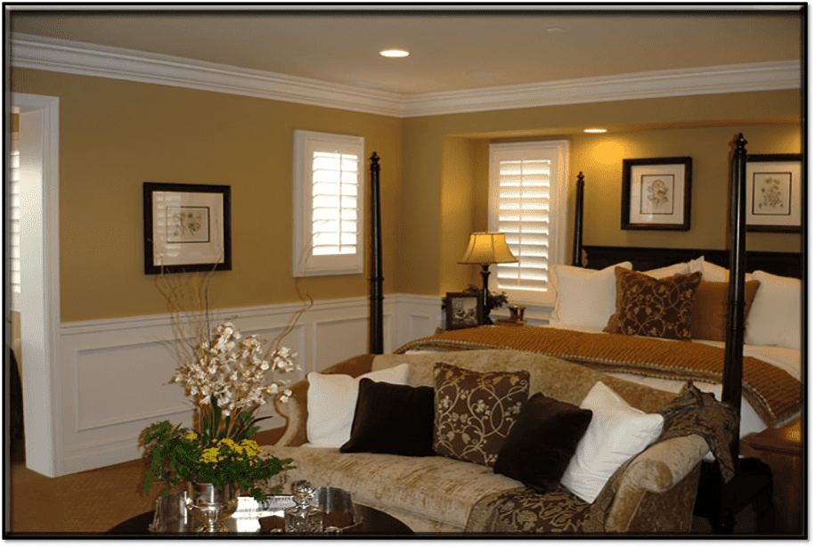 Crown-WainscottLadera-1 (1) (1) Elegant bedroom with cozy decor and lighting.