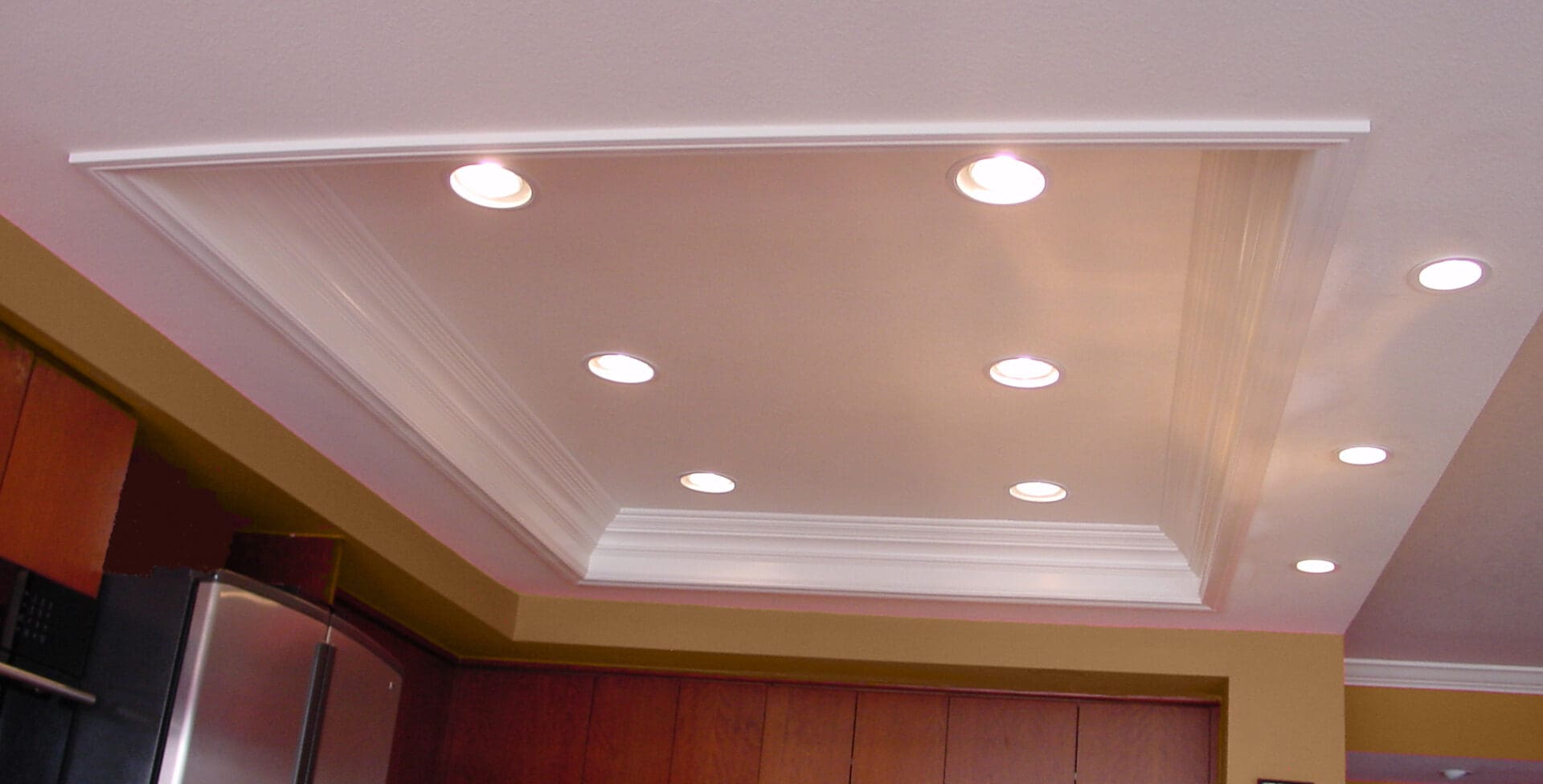Recessed ceiling lights in a modern kitchen.