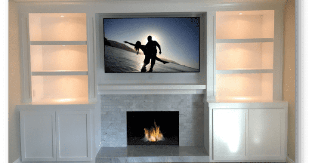 Living room with TV and fireplace.
