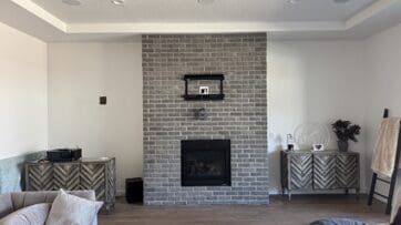 Fireplace wall before custom entertainment center installation in Star, Idaho