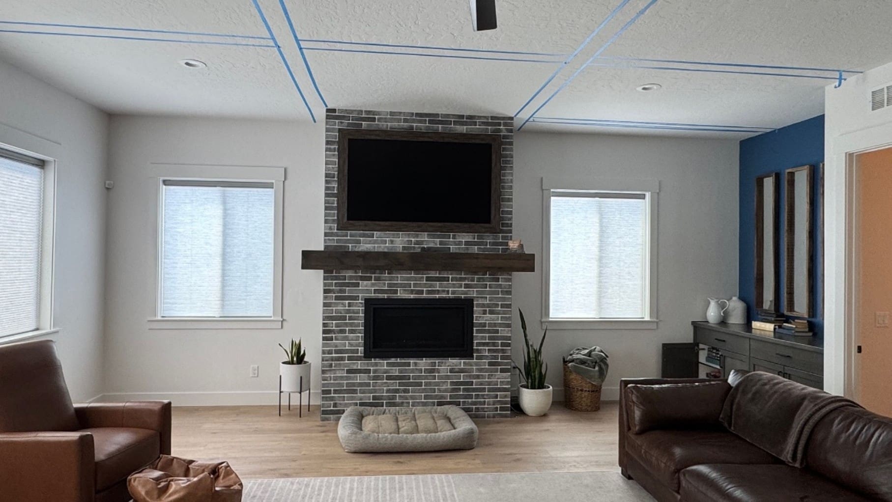 Fireplace wall before custom built-ins installation in Star, Idaho